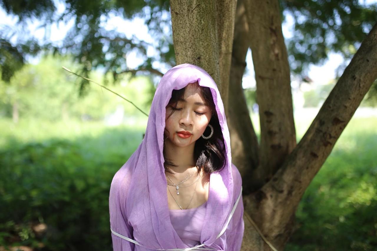 20P Asian seductress Nhatle posing in her amazing Halloween costume outdoors