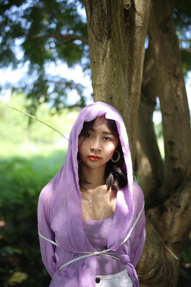 20P Asian seductress Nhatle posing in her amazing Halloween costume outdoors