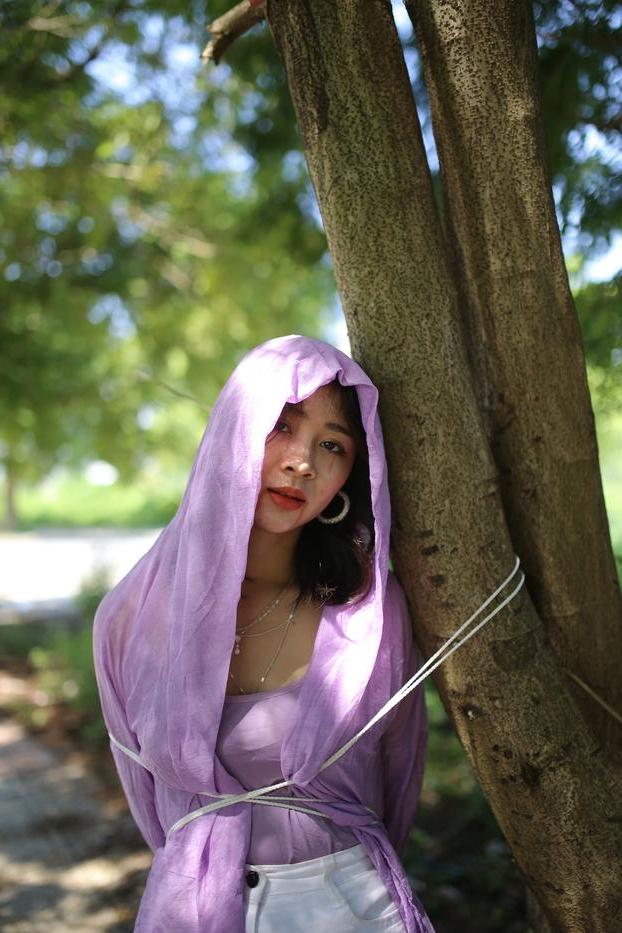 20P Asian seductress Nhatle posing in her amazing Halloween costume outdoors