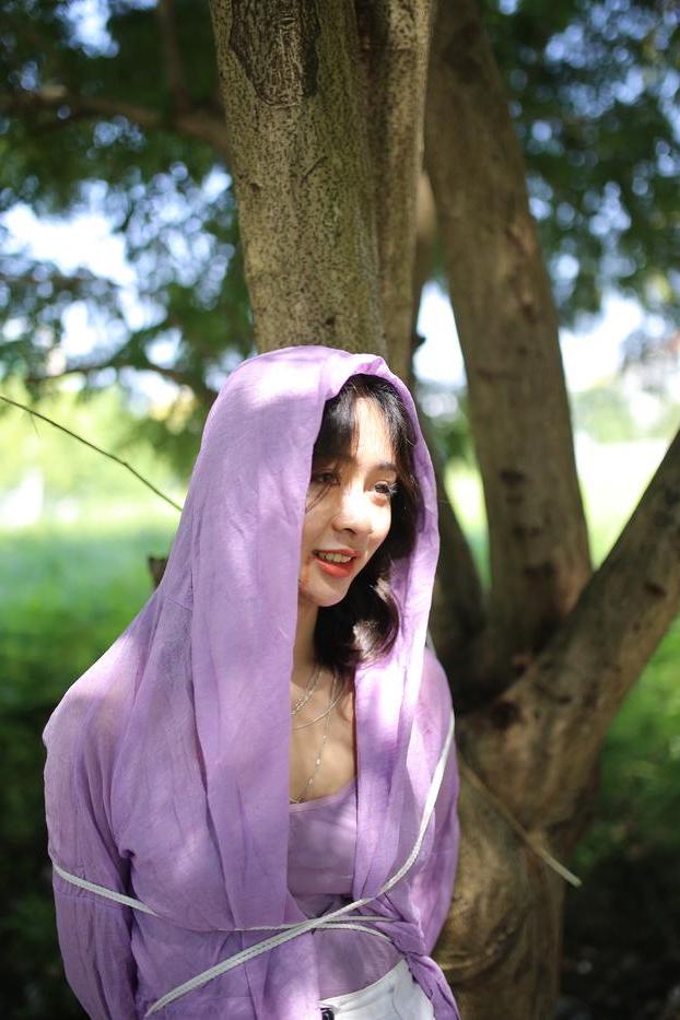20P Asian seductress Nhatle posing in her amazing Halloween costume outdoors
