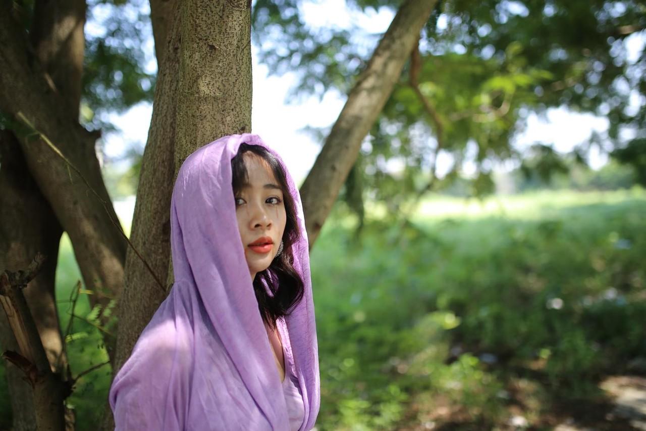20P Asian seductress Nhatle posing in her amazing Halloween costume outdoors