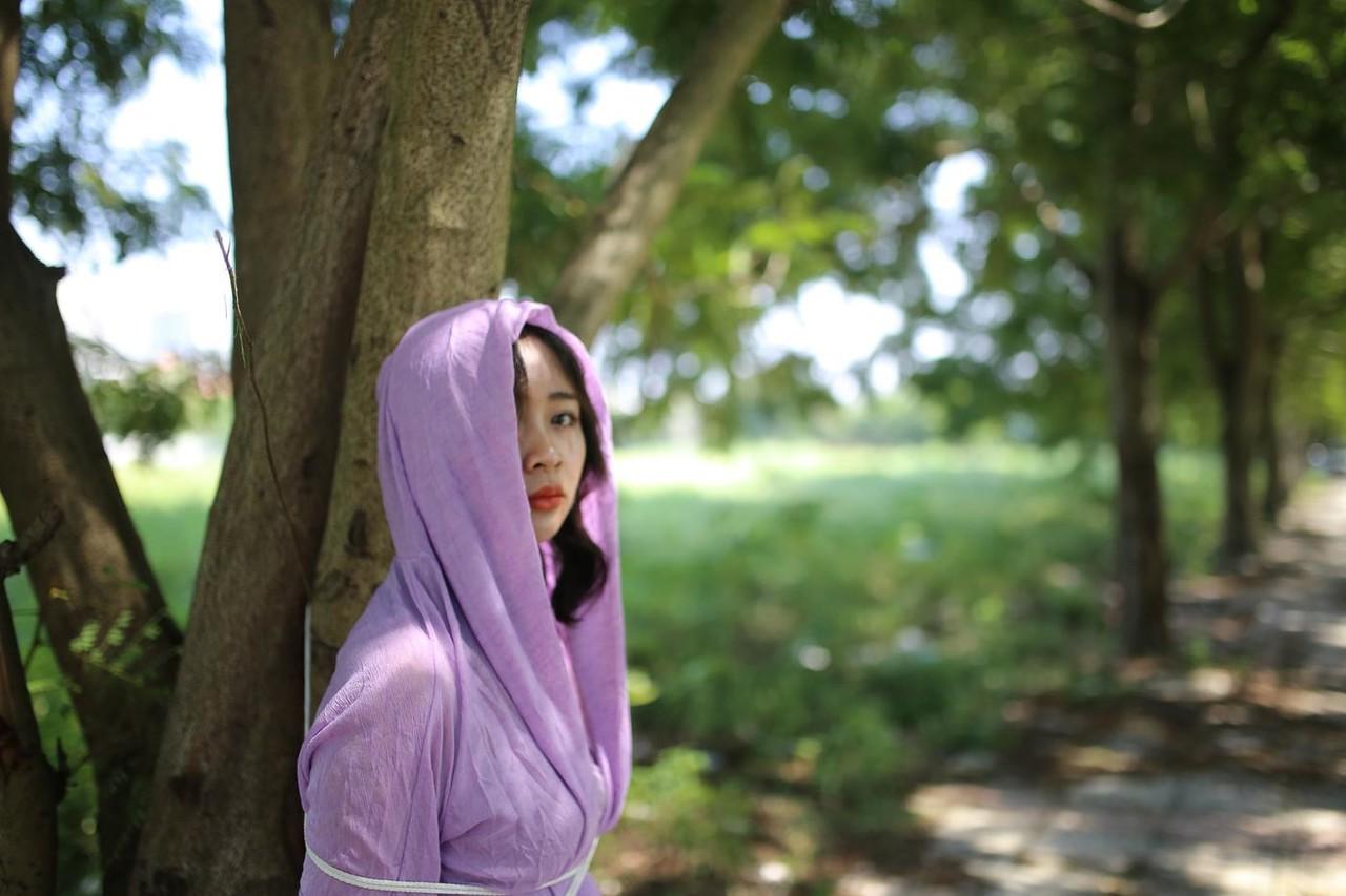 20P Asian seductress Nhatle posing in her amazing Halloween costume outdoors