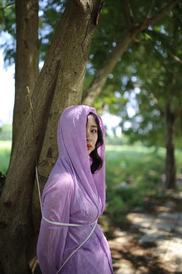 20P Asian seductress Nhatle posing in her amazing Halloween costume outdoors