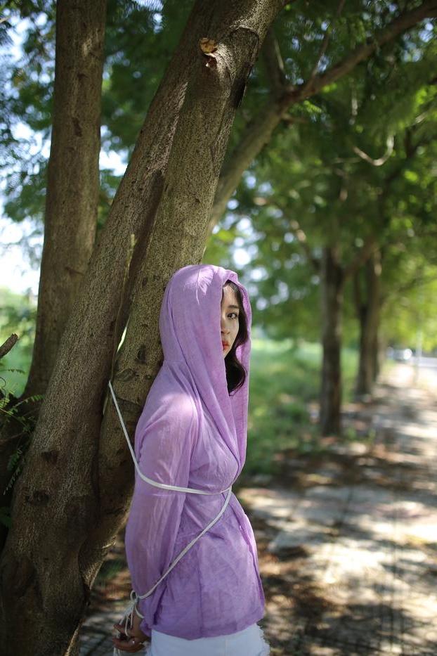 20P Asian seductress Nhatle posing in her amazing Halloween costume outdoors