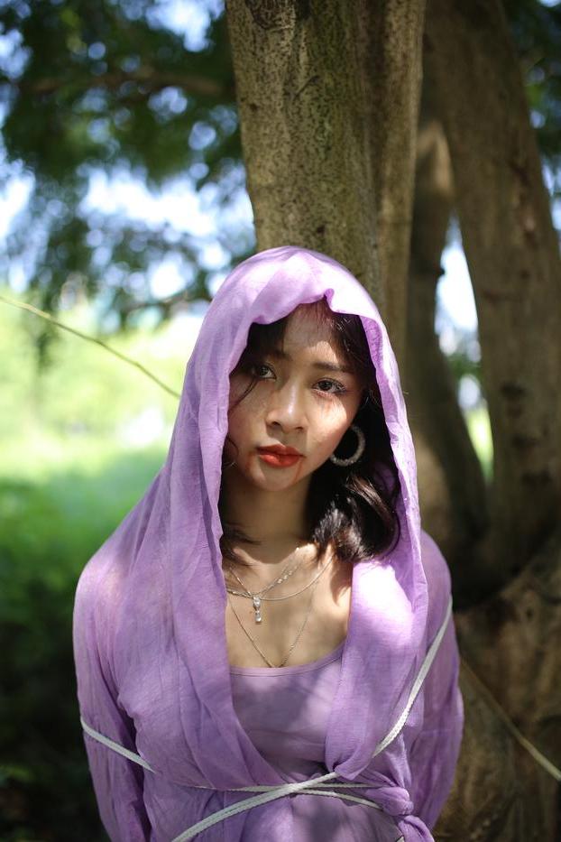 20P Asian seductress Nhatle posing in her amazing Halloween costume outdoors