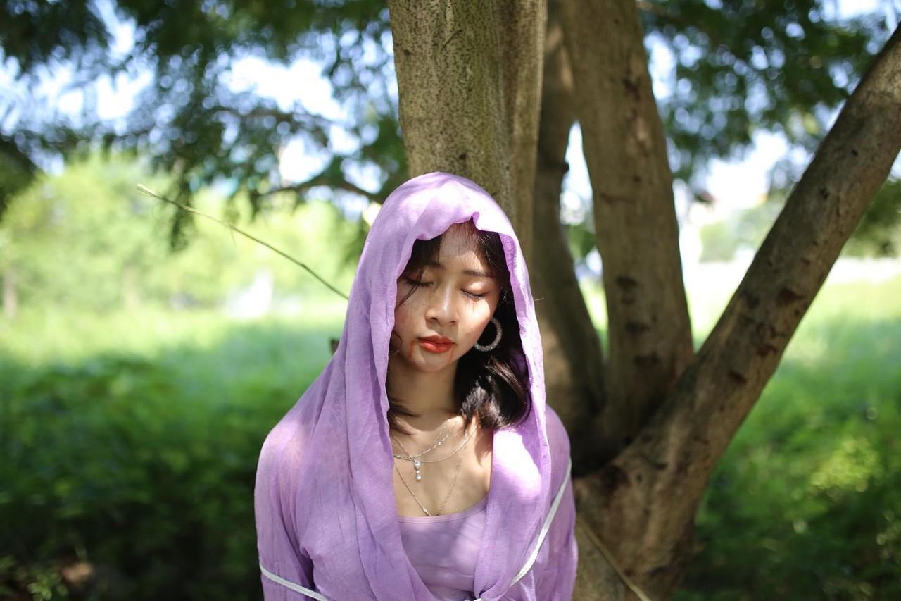 20P Asian seductress Nhatle posing in her amazing Halloween costume outdoors