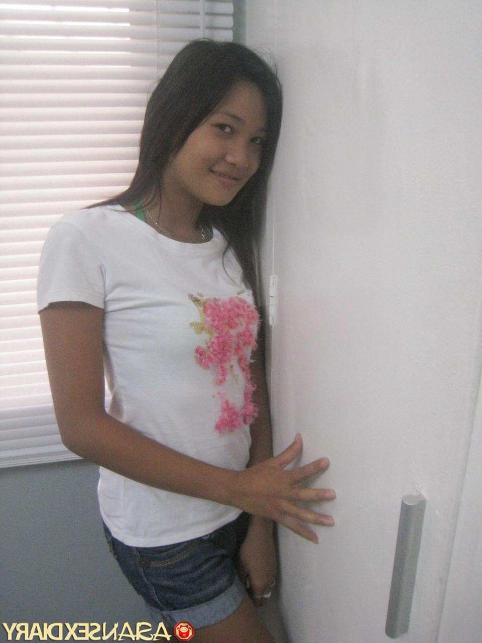 15P Sweet Asian babe Ann stripping and posing naked at the hotel room