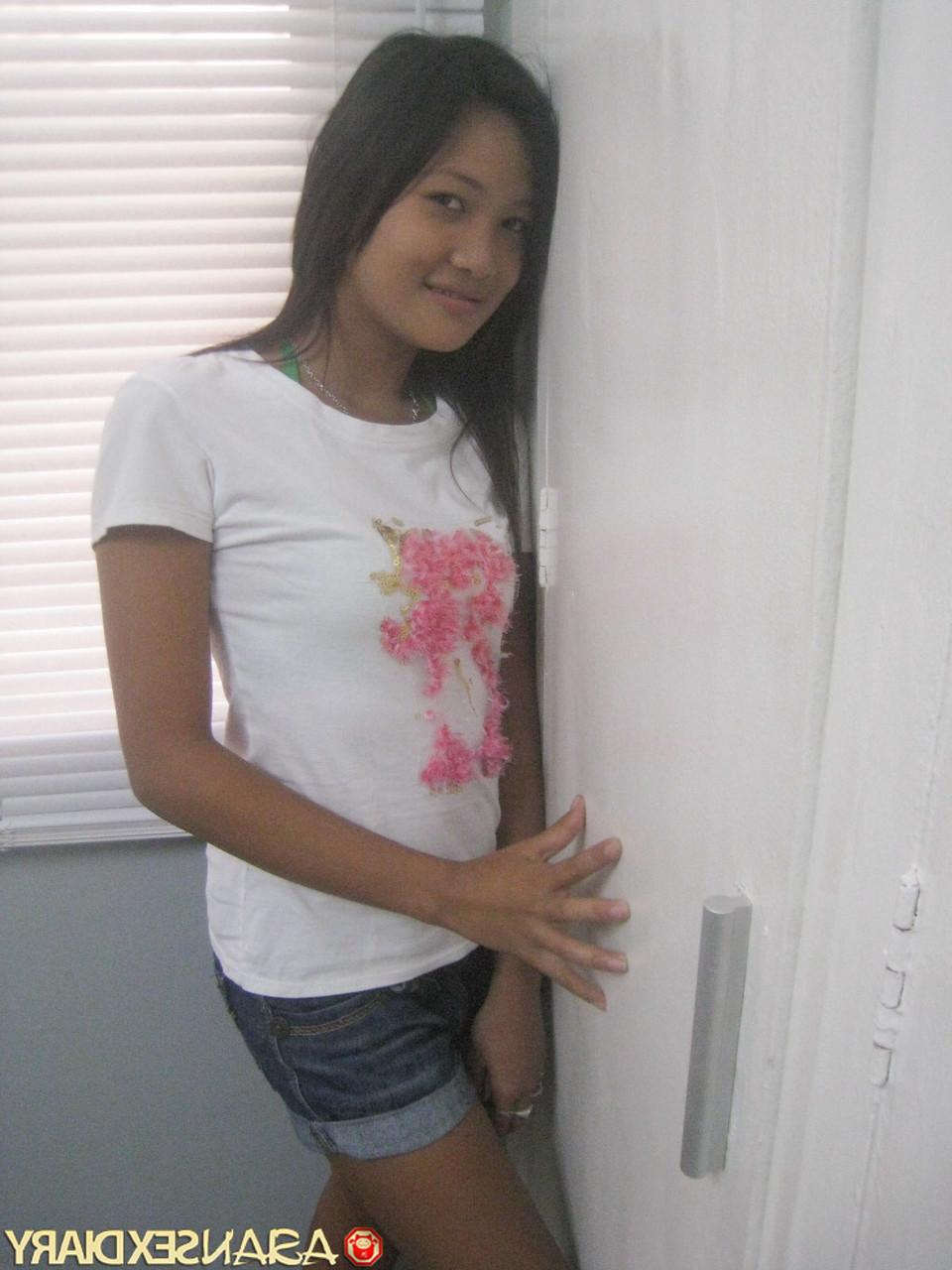 15P Sweet Asian babe Ann stripping and posing naked at the hotel room