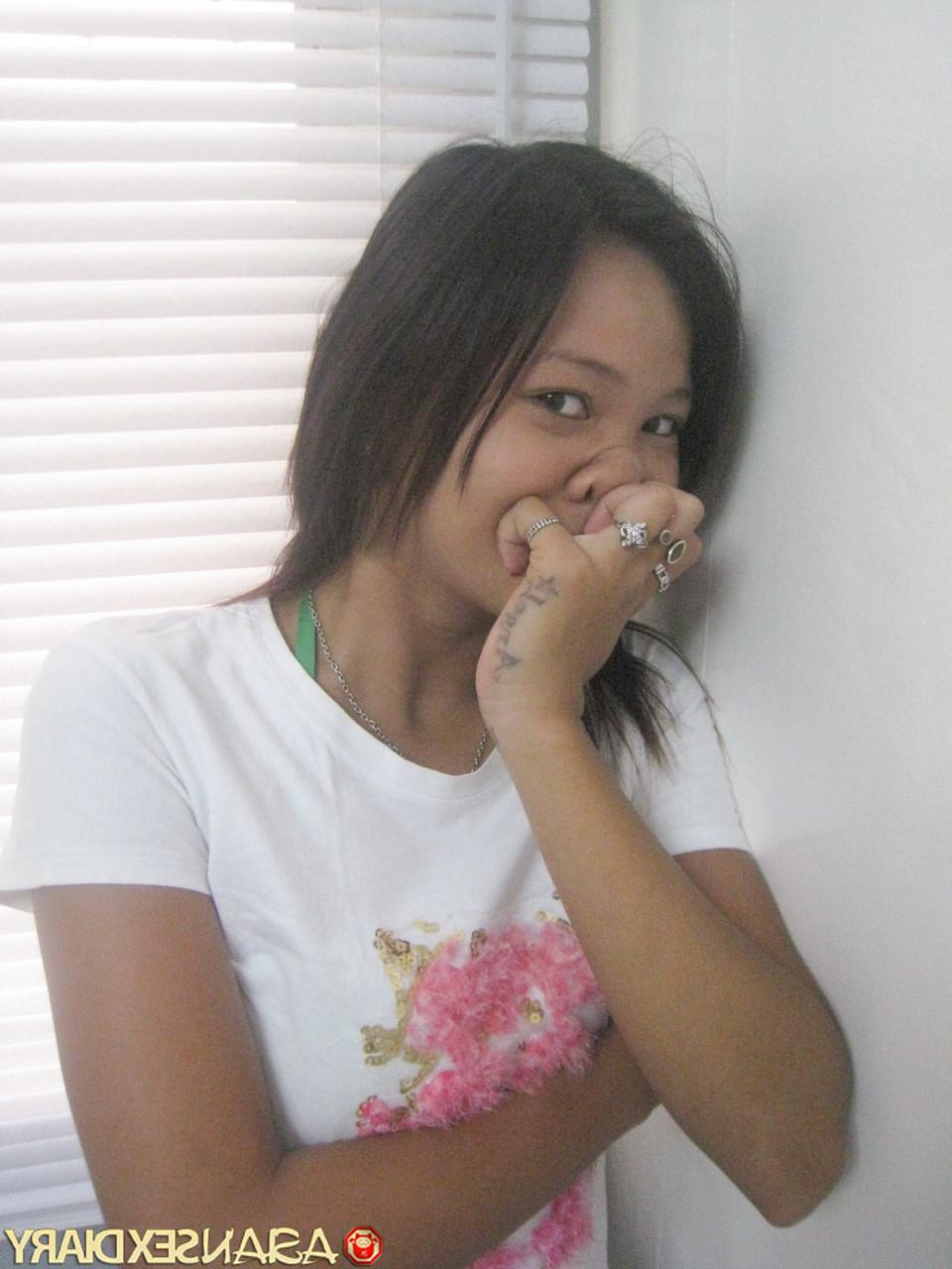 15P Sweet Asian babe Ann stripping and posing naked at the hotel room
