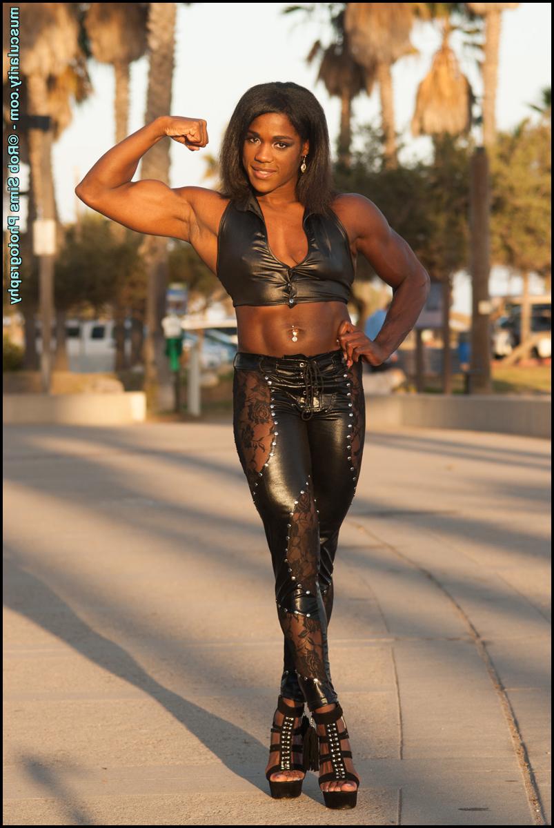 15P Black bodybuilder Jaquita Persons Taylor flexes while walking her dogs