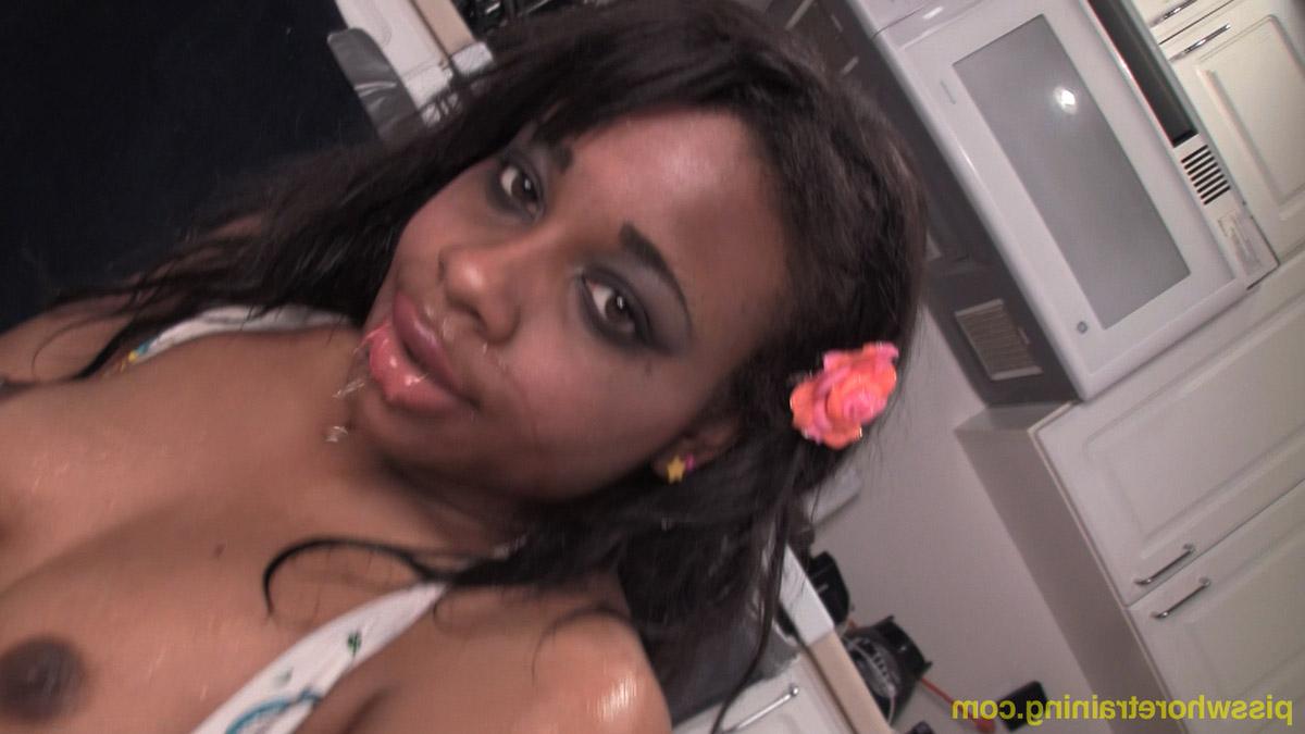 15P Ebony girl Lily swallows a measuring cup full of piss in a kitchen