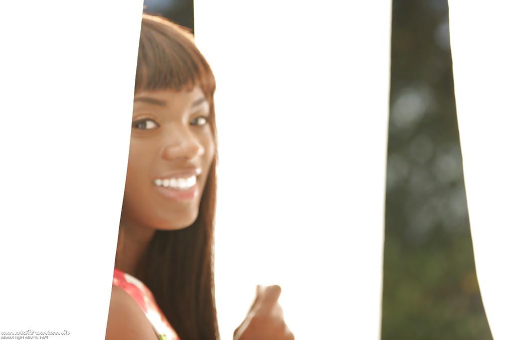 16P Ebony babe Ana Foxxx shows off her nice natural black tits outdoors