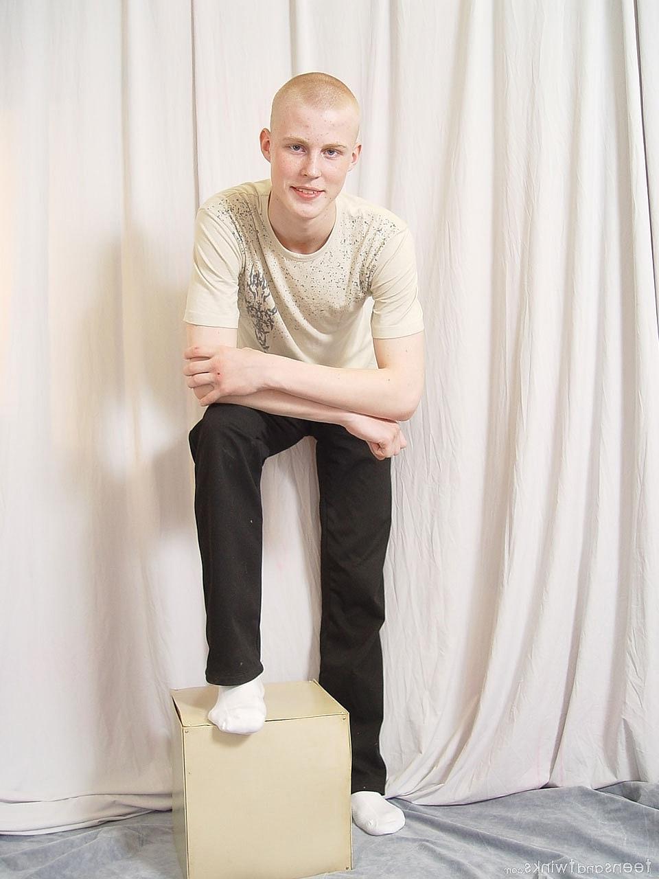 20P Hot twink shows off his fine ass and his uncut hairy cock while fully naked