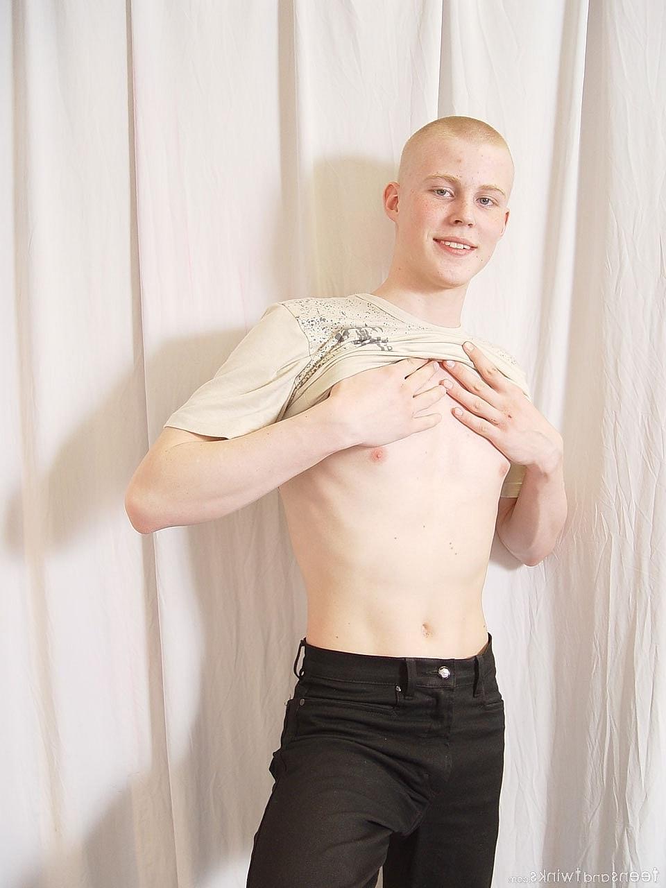 20P Hot twink shows off his fine ass and his uncut hairy cock while fully naked
