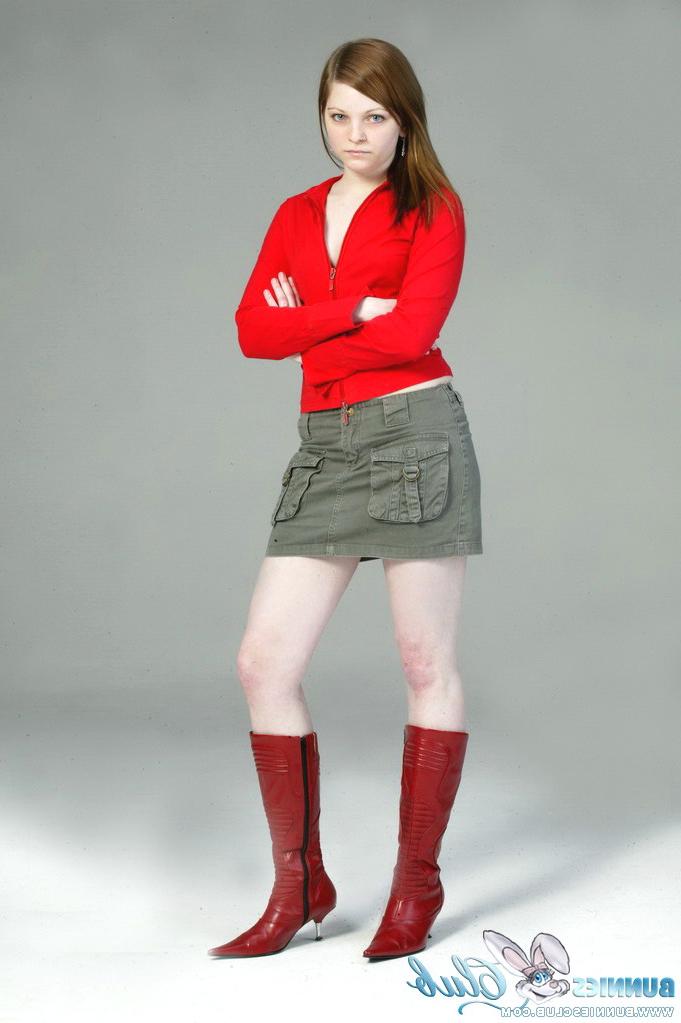 20P Pale redhead Lilly slowly strips to a black G-string and red leather boots
