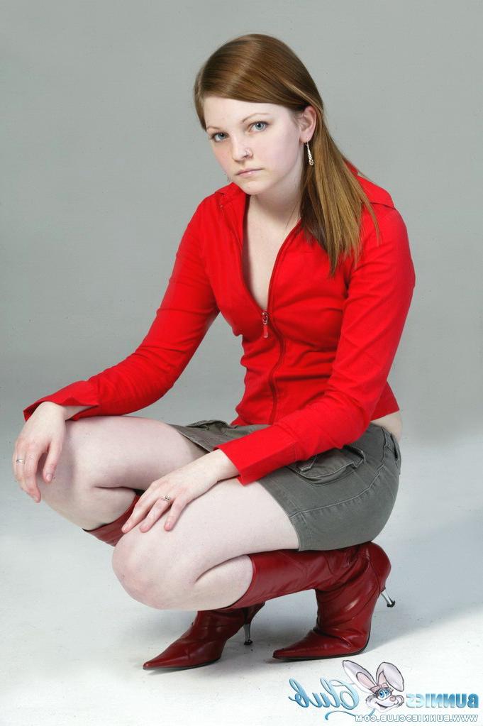 20P Pale redhead Lilly slowly strips to a black G-string and red leather boots