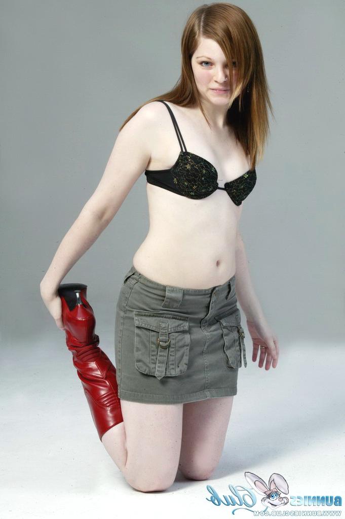 20P Pale redhead Lilly slowly strips to a black G-string and red leather boots