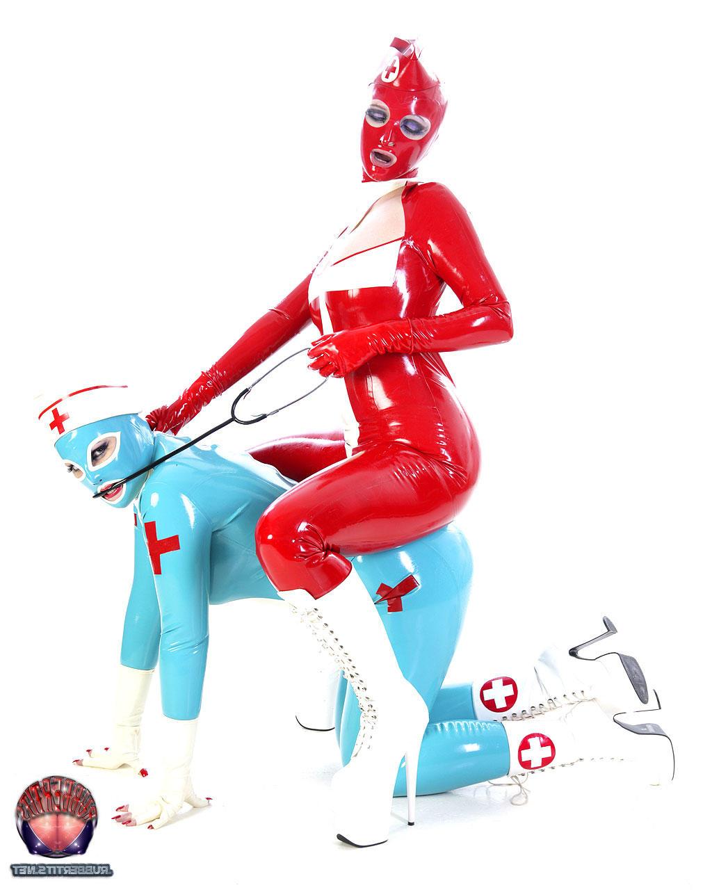16P Fetish models hump each other while wearing latex nurse outfits