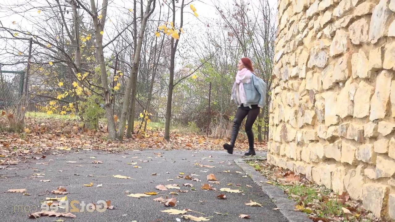 15P Pale redhead Katy Rose gets caught taking a pee on leaves during the day