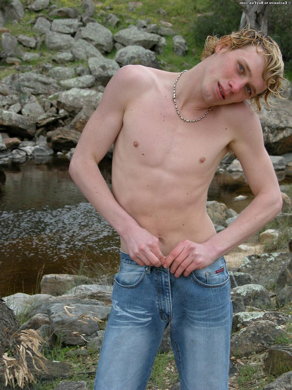 20P Golden-haired gay hottie Jarrod stripping naked and jerking off by the river
