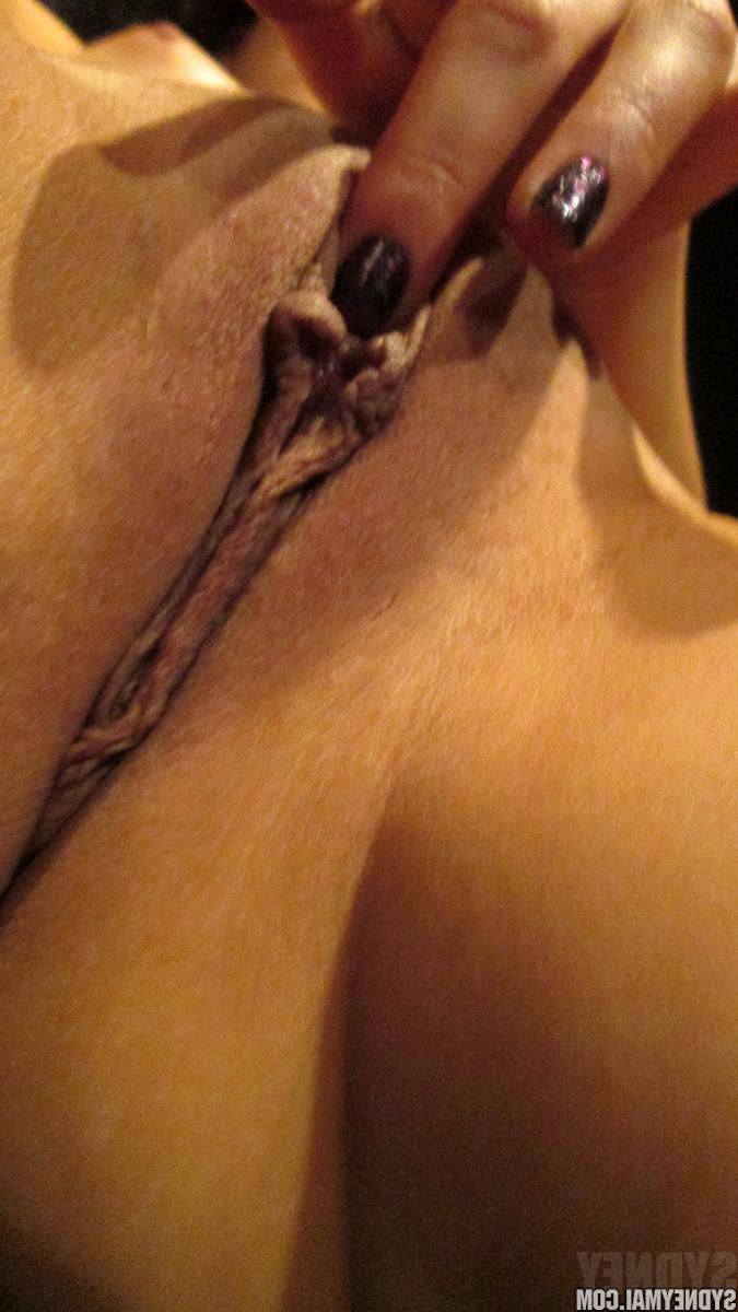 15P Pierced Japanese model Sydney Mai fingering her shaved pussy close up
