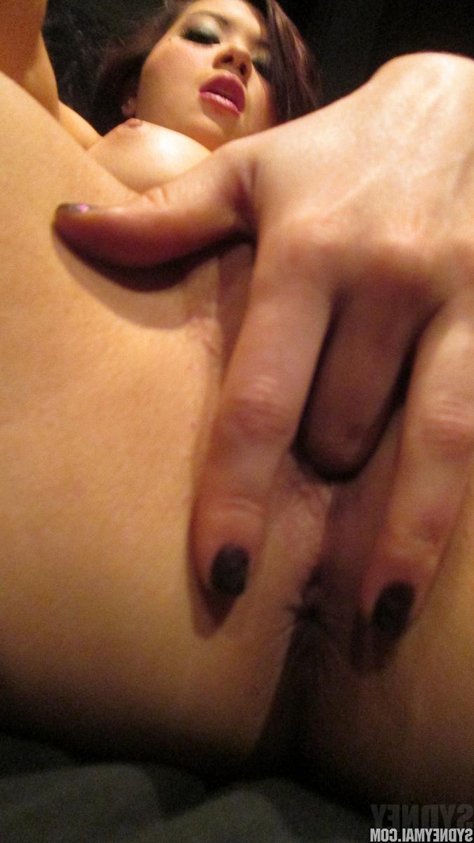 15P Pierced Japanese model Sydney Mai fingering her shaved pussy close up