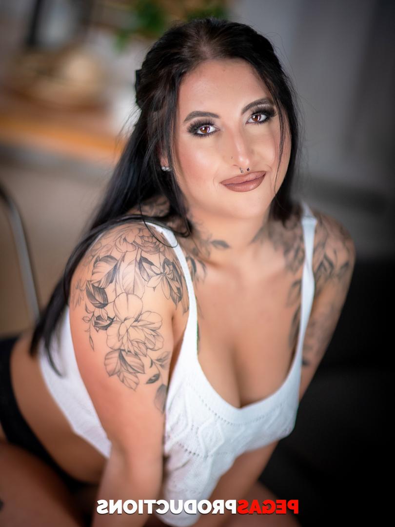 20P Sexy inked MILFs with big tits Sky Fox and Eva Rose pose naked on a couch