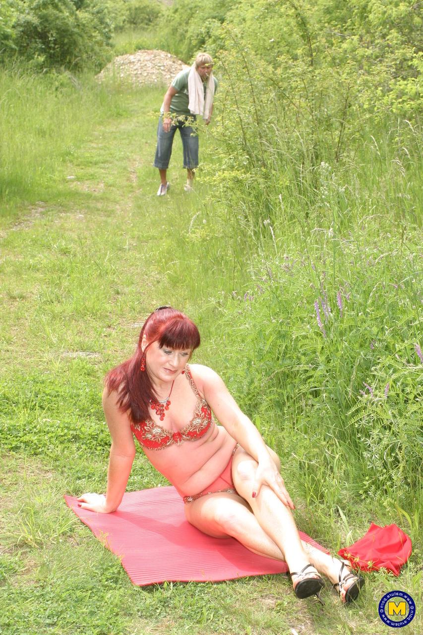 20P Redhead mature Oriana removes her red dress and gets rammed outdoors