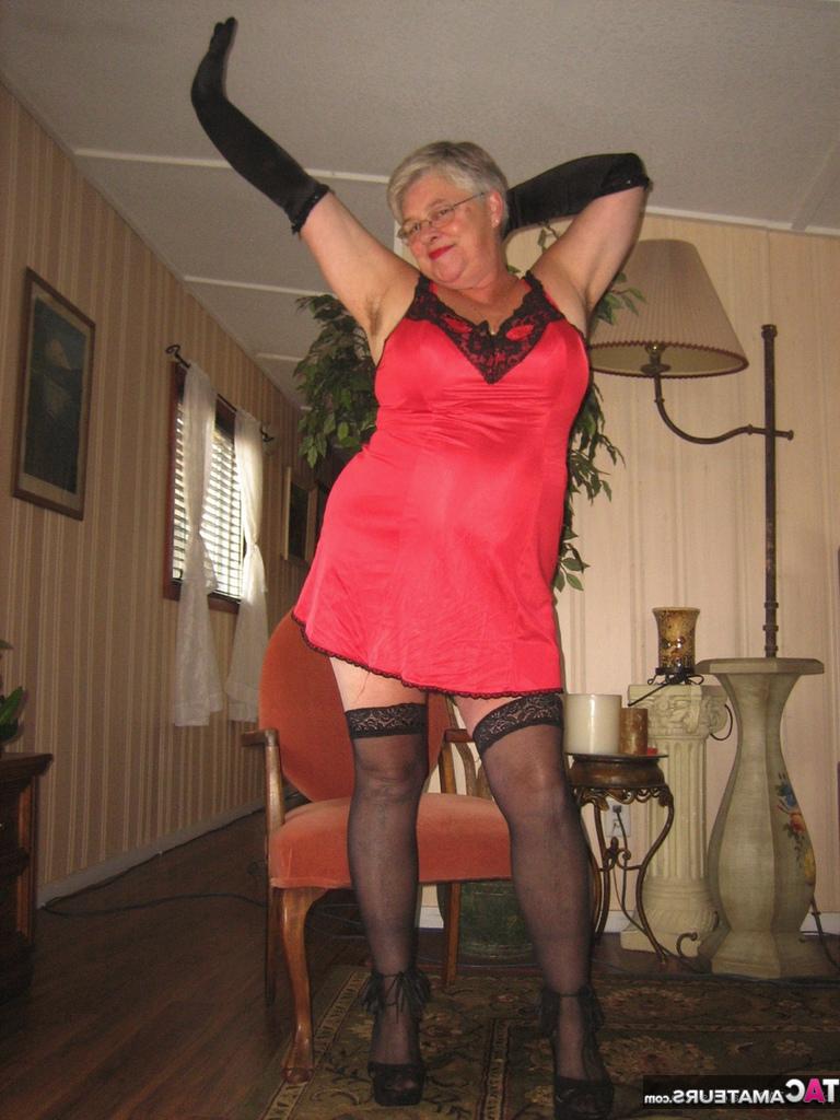 20P Old lady Girdle Goddess casts off lingerie to pose nude in hosiery and gloves