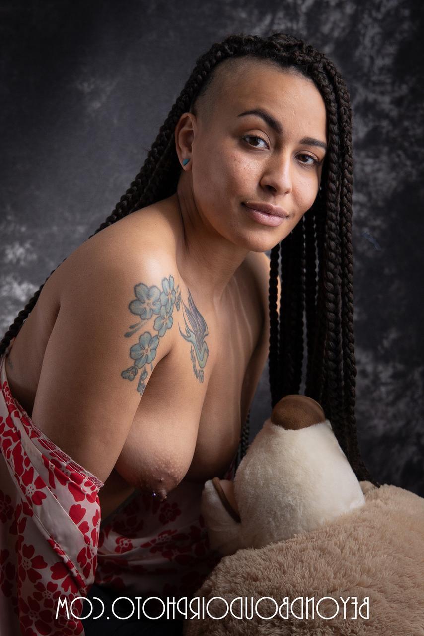 20P Ebony Mistress Tuesday showing off her great tattooed body in a solo