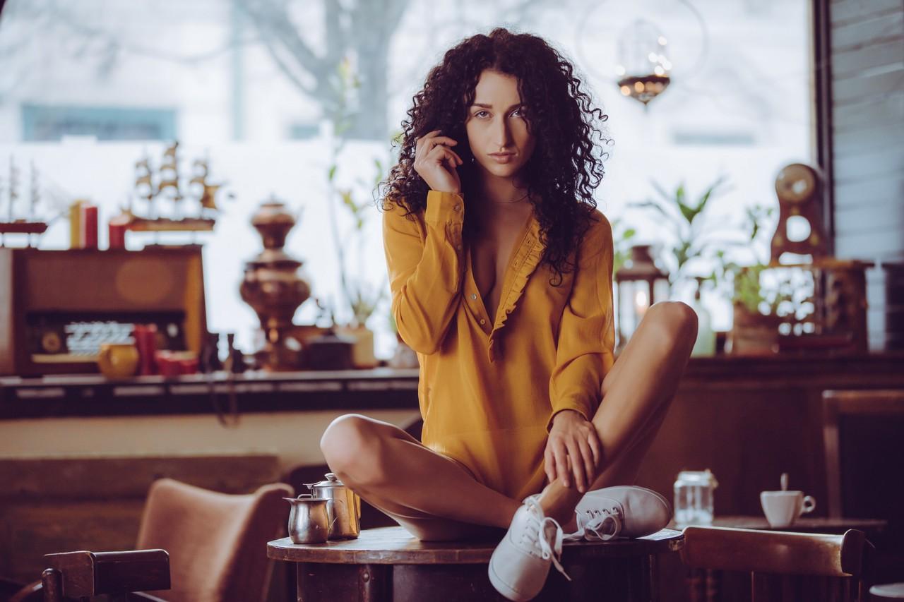 10P Curly haired babe Luca Miklosi strips as she drinks her morning coffee