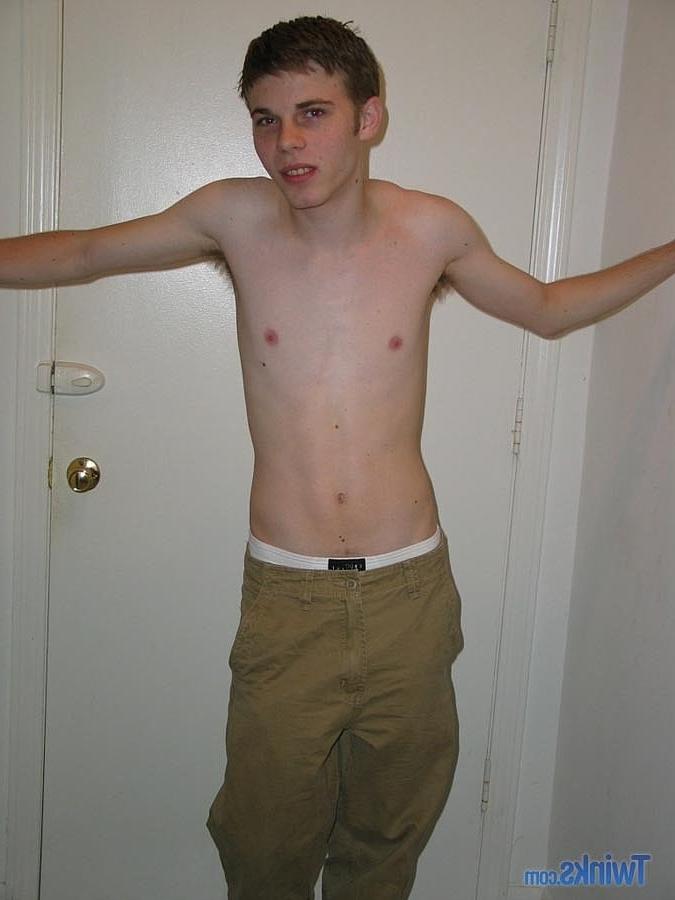 20P Caucasian twink Billy Gee strips and plays with his huge dick in the hallway