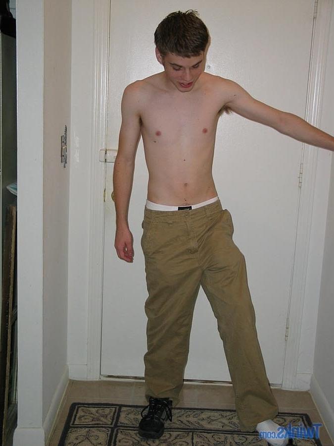 20P Caucasian twink Billy Gee strips and plays with his huge dick in the hallway
