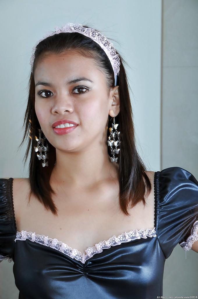 16P Petite Asian chick Clarice modelling solo in sexy French maid uniform