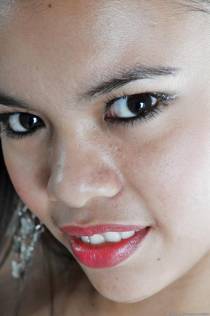16P Petite Asian chick Clarice modelling solo in sexy French maid uniform