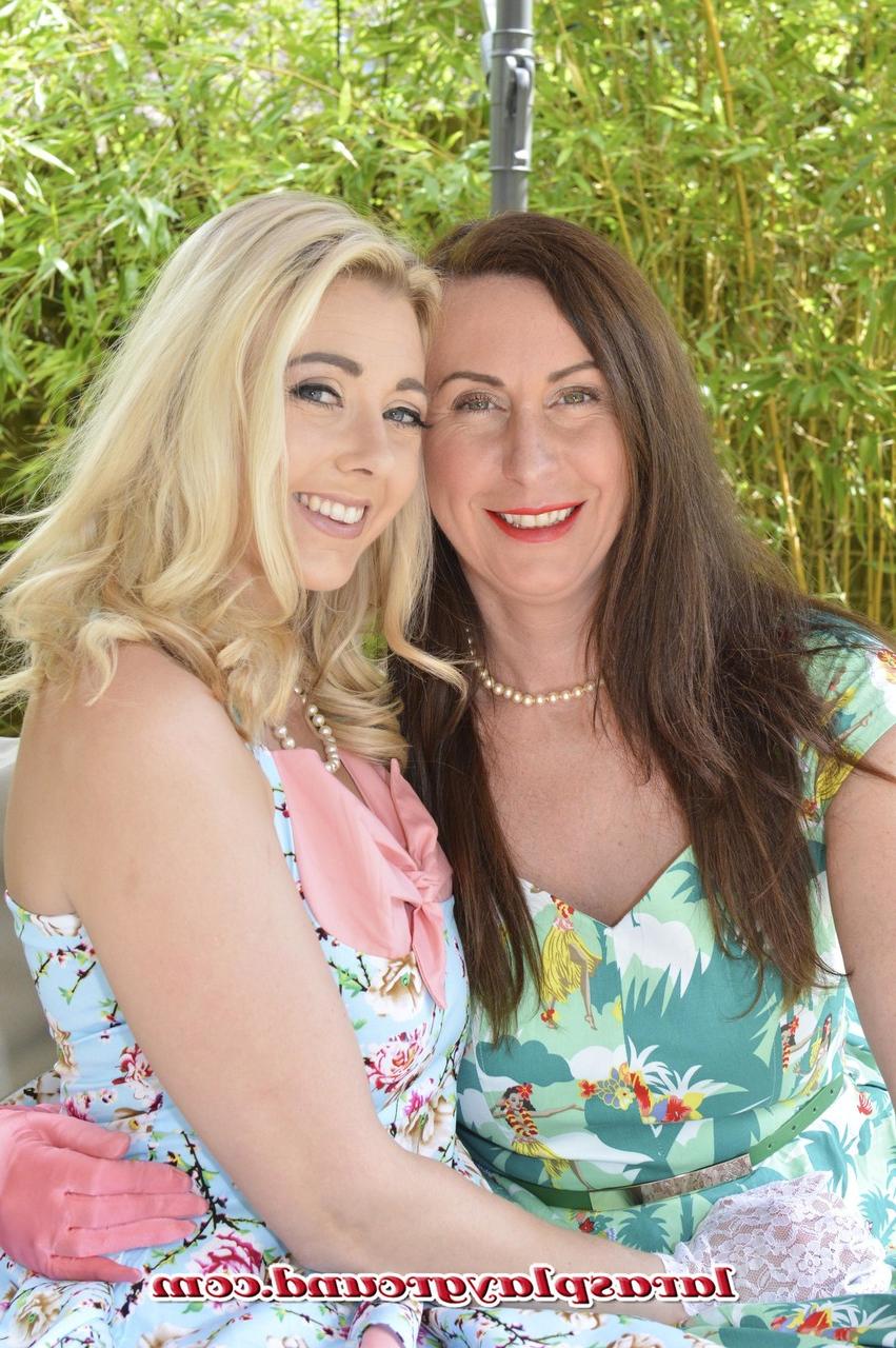 20P Glamorous lesbians Sapphire & Lara finger each other's snatches outdoors