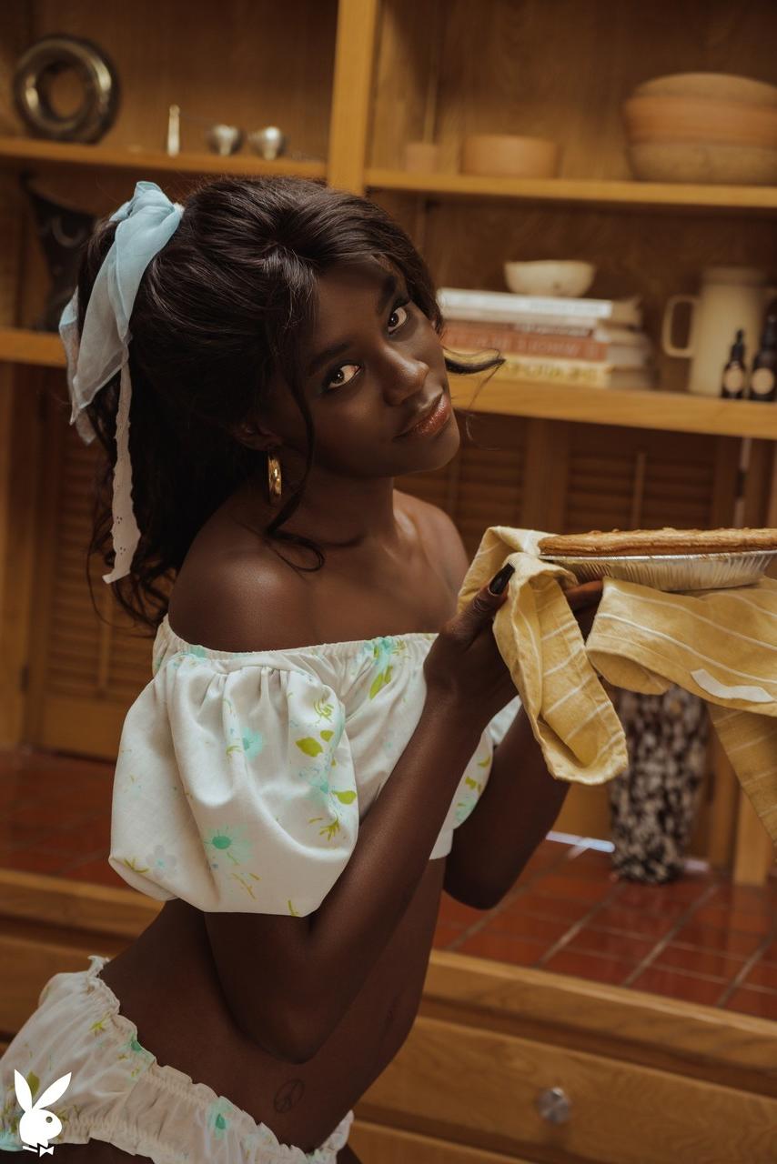 20P Glamorous black babe Victoria Antoinette does a sexy striptease in the kitchen