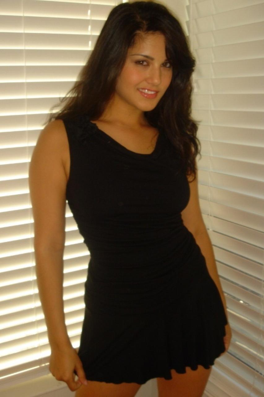 20P Beautiful brunette MILF Sunny Leone shows her tight trimmed pussy up close