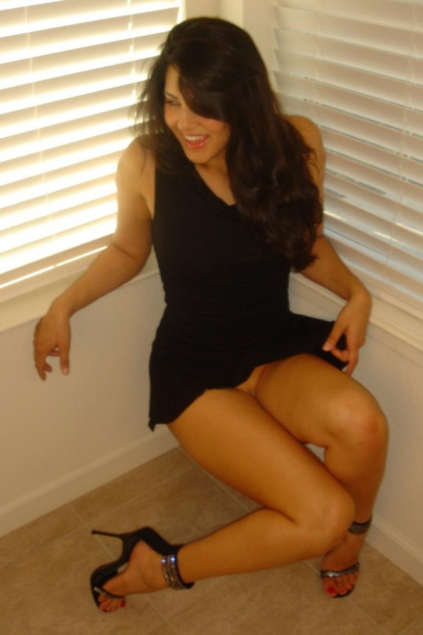 20P Beautiful brunette MILF Sunny Leone shows her tight trimmed pussy up close