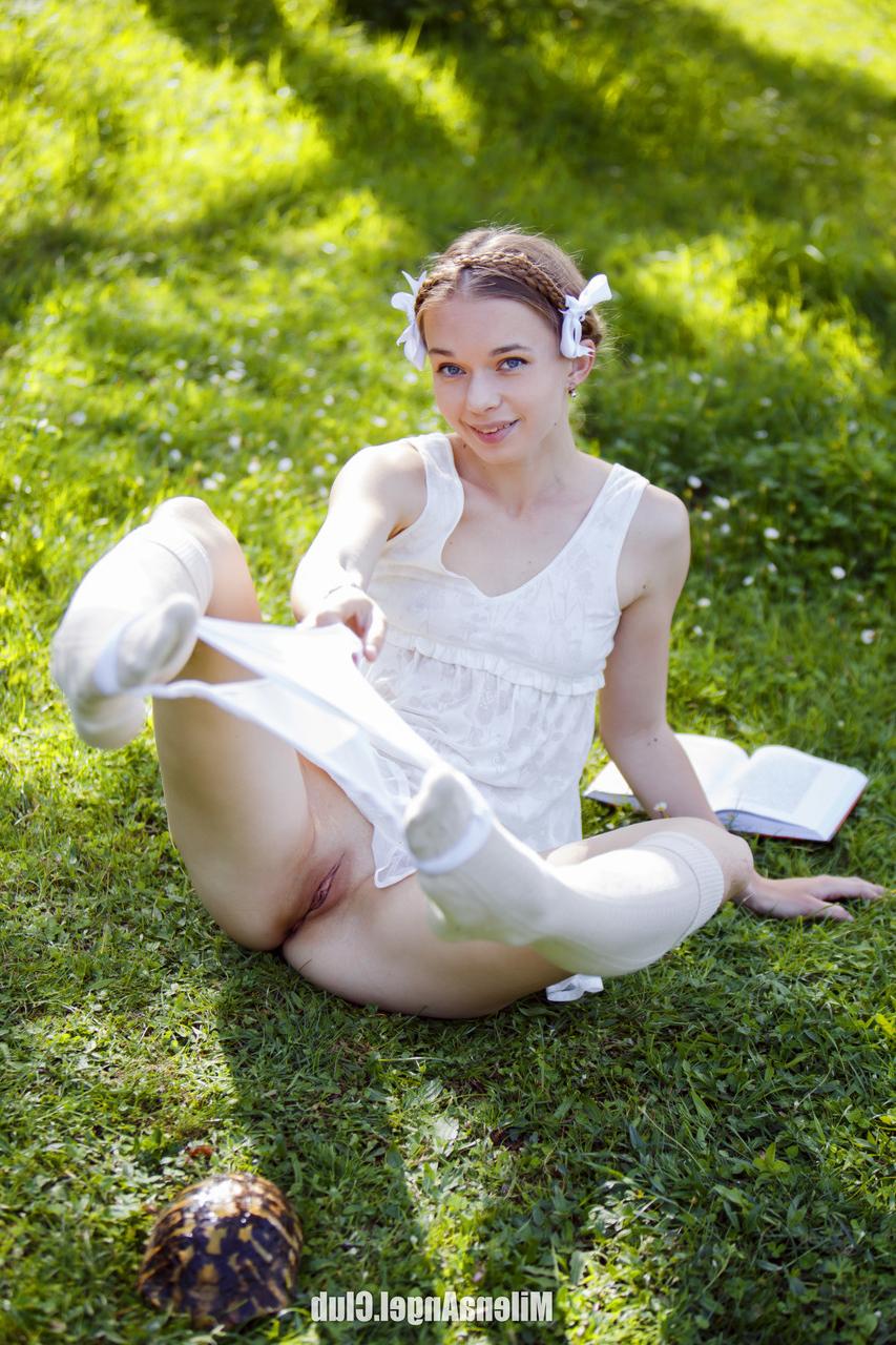 15P Gorgeous babe Milena Angel poses in her white lingerie and strips outside
