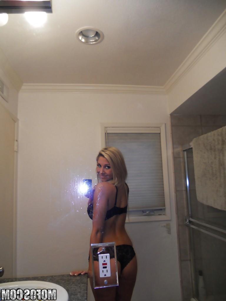 16P Natalie Vegas picturing herself and stripping off her lacy lingerie top