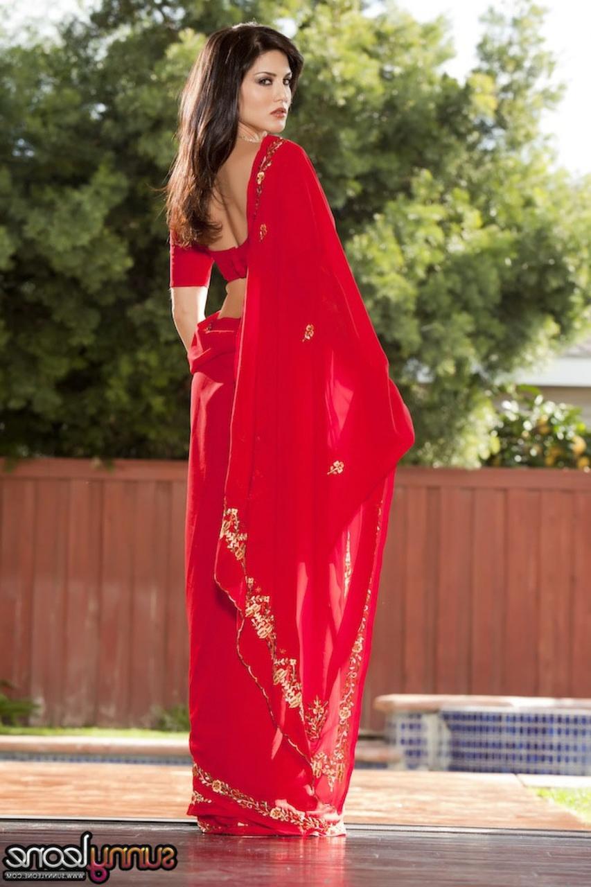 20P Brunette Indian goddess Sunny Leone teases with her big tits outdoors