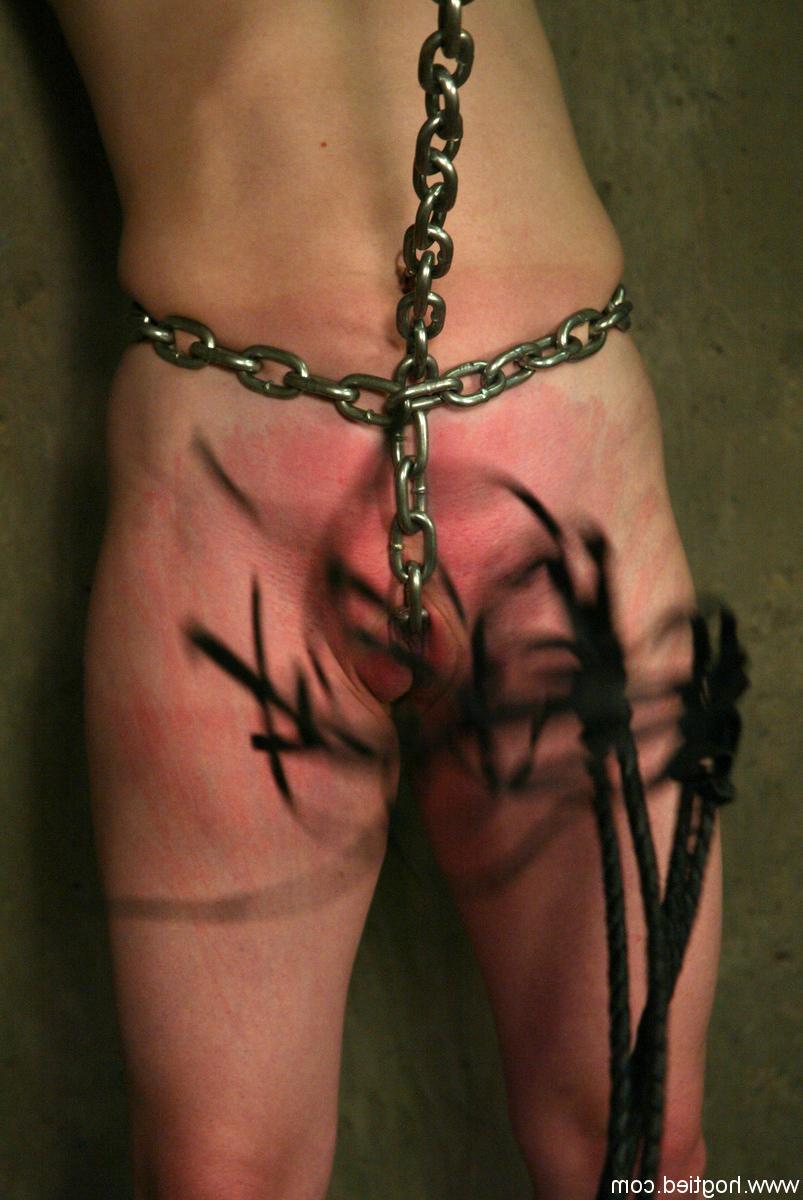 11P Redhead female Madison Young is flogged while restrained by her handler