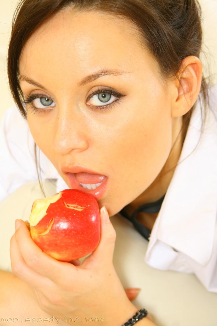20P Lusty Carla bites apple and strips her clothes to pose in knee high socks only