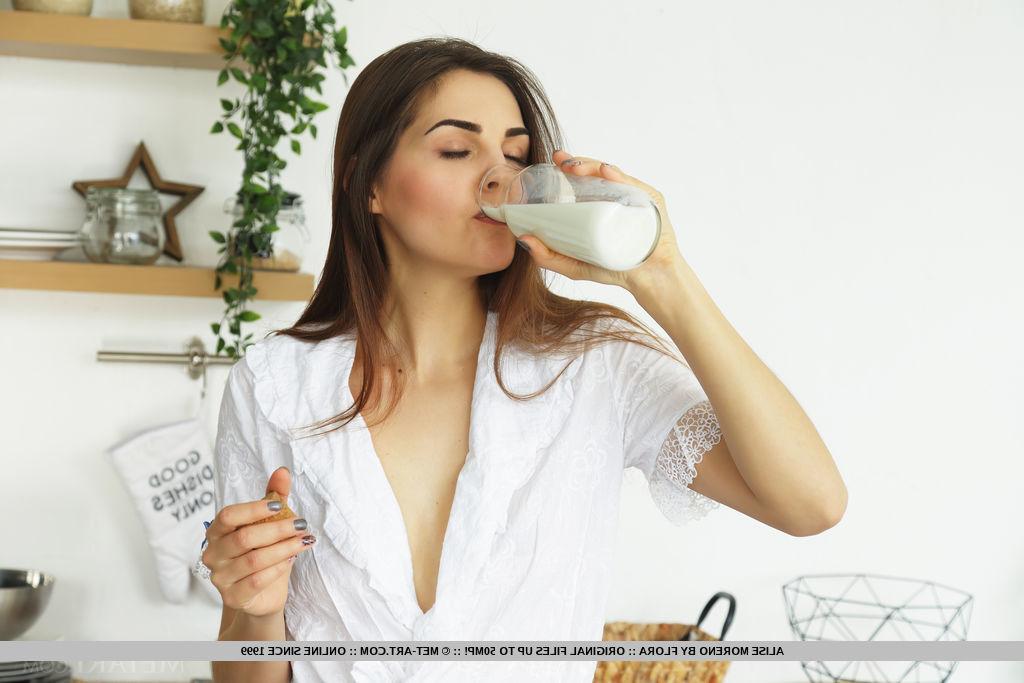 18P Beautiful teen Alise Moreno Downs a pitcher of milk before getting bare naked