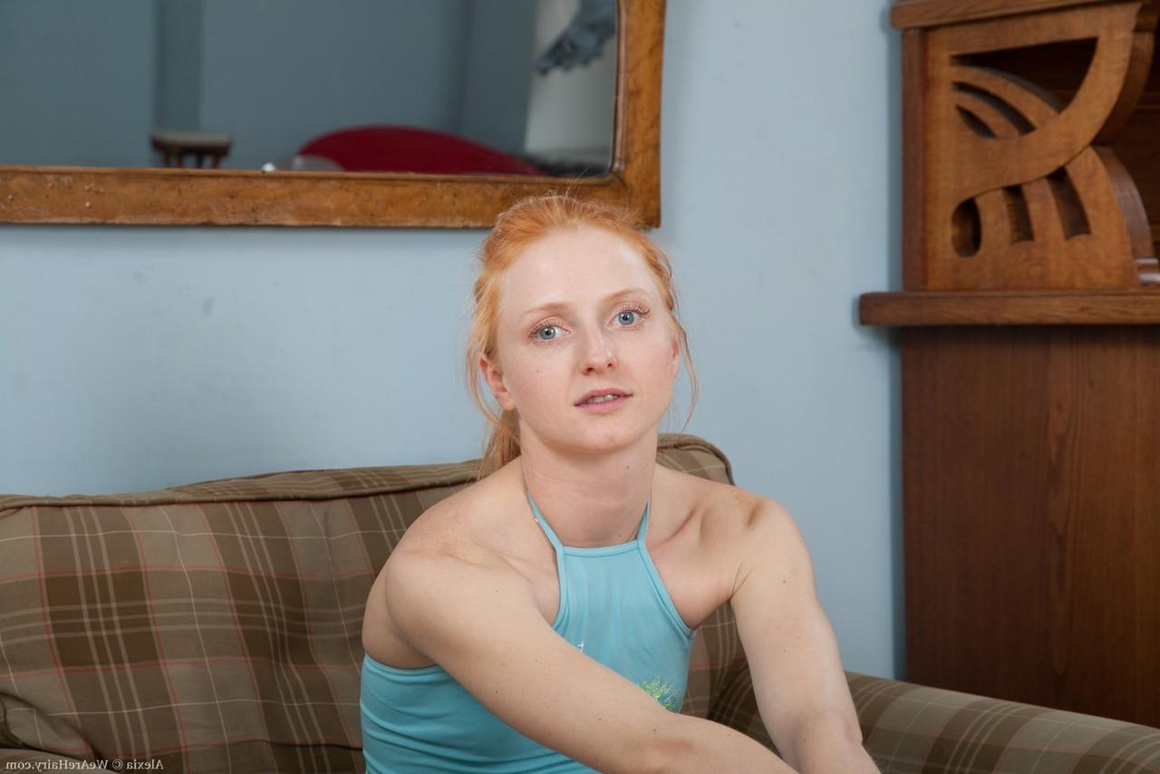 12P Pale redhead shows off her all natural vagina wearing blue fishnet stockings