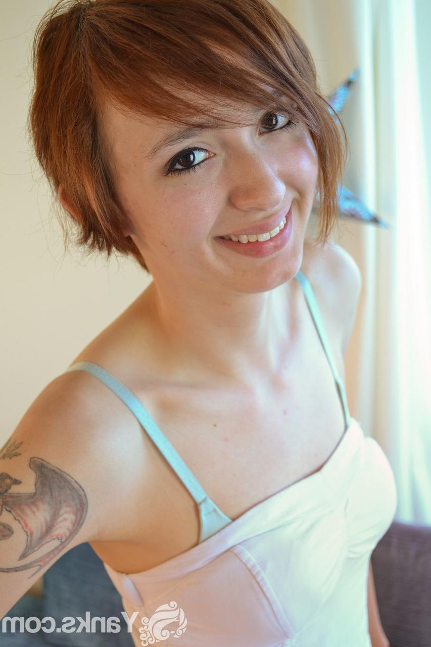 17P Redhead with pierced nipples and tattoos masturbates with pink vibrator