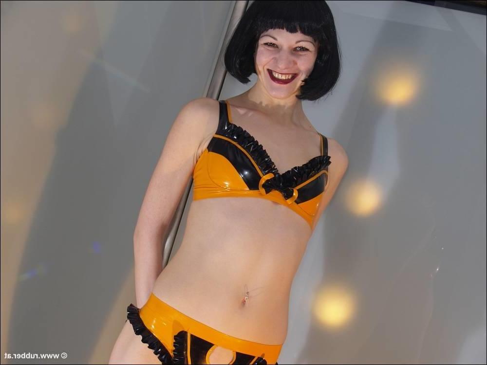 16P Dark-haired girl is restrained and masturbated in latex before posing alone