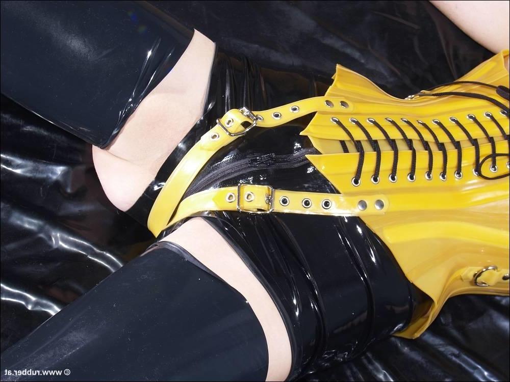 16P Dark-haired girl is restrained and masturbated in latex before posing alone