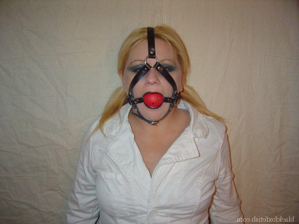 16P Blonde chick is silenced with a ball gag while showing her breasts